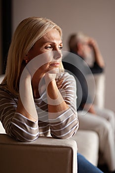 Portrait of an upset woman, a quarrel in the family. Victim of domestic violence, relationship difficulties. Husband and wife in