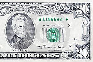 Portrait of US president Andrew Jackson on 20 dollars banknote closeup macro fragment