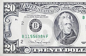 Portrait of US president Andrew Jackson on 20 dollars banknote closeup macro fragment