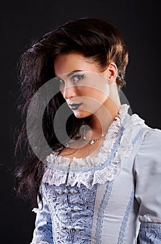 Portrait of vampire woman aristocrat with stage makeup