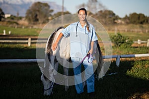 Portrait of vet with horse