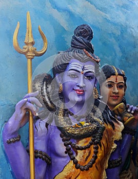 Portrait view of  hindu god Shiva and parvati wall art in a temple