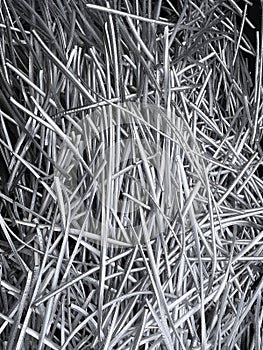 Portrait view of a large heap of pure aluminium wire recycled from industrial power cables