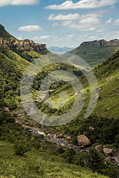 Portrait view of the river gorge, cliffs and mountain sides on the Thukela hike to the bottom of the Amphitheatre`s Tugela Falls