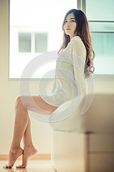 portrait in vintage style. Beautiful woman in white bathrob