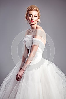 Portrait in vogue style of fashion beautiful bride in wedding dr