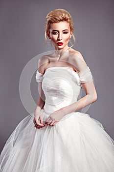 Portrait in vogue style of fashion beautiful bride in wedding dr