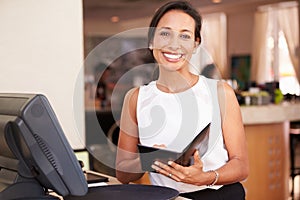 Portrait Of Waitress In Hotel Restaurant Preparing Bill