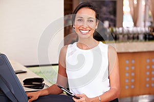 Portrait Of Waitress In Hotel Restaurant Preparing Bill