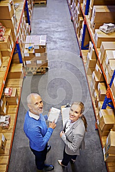 Portrait, warehouse and man with woman, inspector and documents with shipping form and cargo. Tablet, factory and