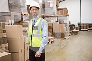 Portrait of warehouse worker with clipboard