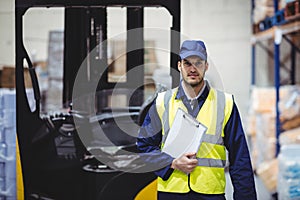 Portrait of warehouse worker with clipboard