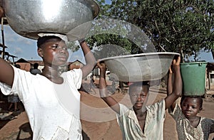 Portrait of water carrying Ghanaians Girls, Ghana