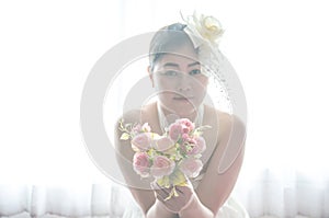 Portrait Wedding asian woman. Beautiful bride with bouquet