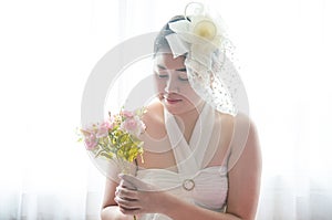 Portrait Wedding asian woman. Beautiful bride with bouquet