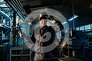 Portrait of a welder posing in a workshop