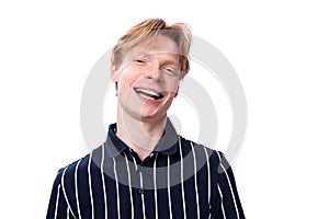 portrait of a well-groomed handsome European 25s blond man in a blue polo