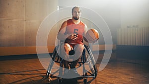 Portrait of Wheelchair Basketball Player Holding, Dribbling Ball, Training. Determination, Trainin