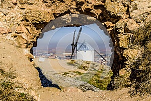 Portrait Of A Windmill Through A Hole In The Mountain On Cerro Calderico In Consuegra. December 26, 2018. Consuegra Toledo