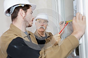 Portrait window installer team