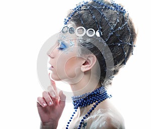 Portrait of winter queen with artistic make-up. Isolated on whit