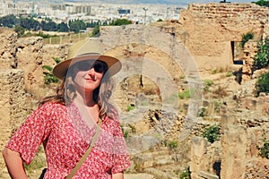 Portrait of a woman against the ruins of Carthage