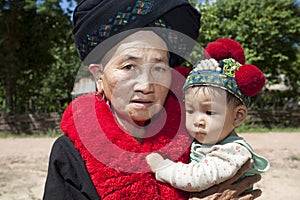 Portrait woman Asia with baby, ethnic group Yao