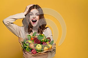 portrait of a woman beige coat fruit bouquet in hands present Studio Model