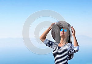 Portrait of a woman in the big stripy hat