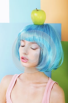 Portrait of Woman in Blue Wig with Green Apple