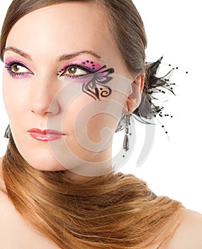 Portrait of woman with body art butterfly on face