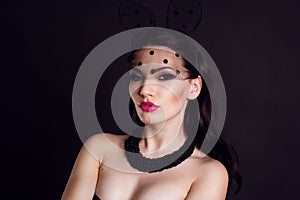 Portrait of woman in bunny lace ears mask