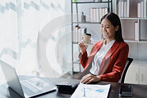 Portrait of a woman business owner showing a happy smiling face as he has successfully invested her business using