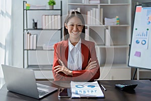 Portrait of a woman business owner showing a happy smiling face as he has successfully invested her business using