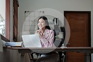 Portrait of a woman business owner showing a happy smiling face as he has successfully invested her business using