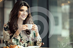 Portrait of a woman in cafe during breakfast