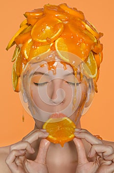 Portrait woman in cap of oranges