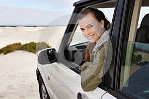 Portrait, woman or car window on desert, road trip or getaway for travel and adventure in Namibia. Smile, female person