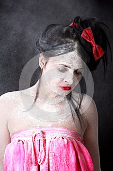 Portrait of a woman in a cloud of white powder