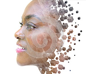 A portrait of a woman combined with 3D graphics in a double exposure technique.