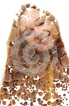 A portrait of a woman combined with 3d spheres in a double exposure technique.