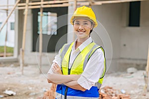Portrait woman contruction worker smart confident look with engineer safety suit work in construction site