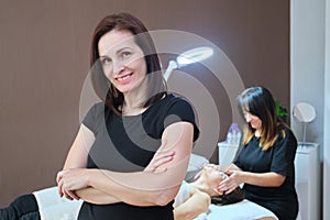 Portrait of woman cosmetologist at beauty clinic