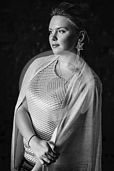 Portrait of woman, creating wedding jewelry, workplace of decorator. Woman`s hands in a process of creation