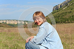 Portrait of woman on Crimean mountains background