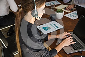 Portrait of woman customer service worker, call center smiling operator with phone on office