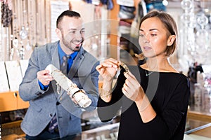 Portrait of woman customer trying bracelet