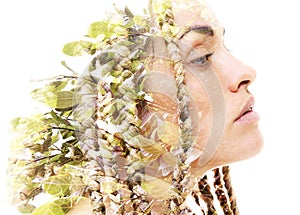 A portrait of a woman dissolving into foliage. Double exposure technique.
