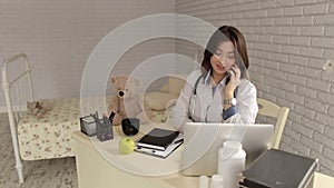 Portrait of woman doctor with phone in clinic.