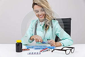 Portrait of woman doctor with pills